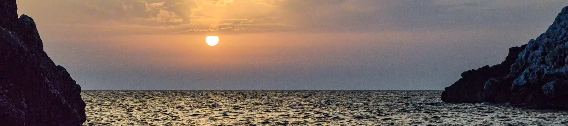 Sunset over the Ionian Sea at Grama Bay on the Karaburun Peninsula, Albanian Riviera.